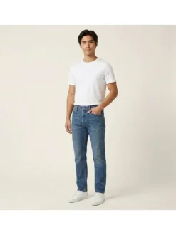 Jean en coton indigo uni avec une coupe slim et une fermeture par zip et bouton