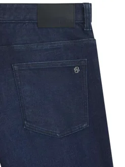 Jean en coton indigo uni avec une coupe slim à zip et bouton