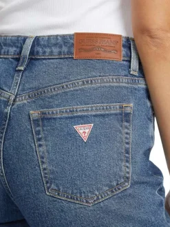 Jean en coton mélangé bleu délavé avec une coupe mom et une taille haute