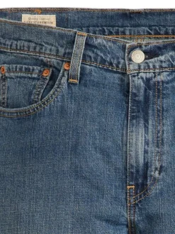 Jean 512 en coton mélangé bleu uni avec une coupe slim et des passants