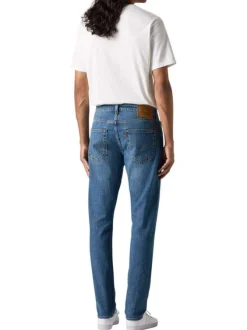 Jean 512 en coton mélangé bleu uni avec une coupe slim et des passants