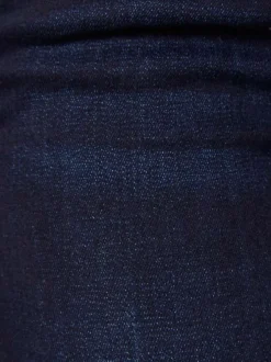 Jean en coton mélangé brut avec une coupe skinny et des passants