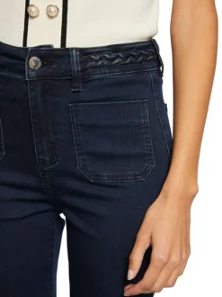 Jean en coton mélangé brut uni à coupe bootcut et nattes denim à la taille