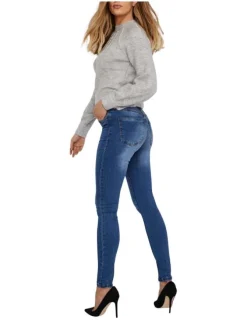 Jean en coton mélangé indigo effet délavé à coupe slim et taille haute