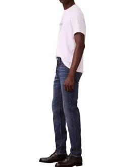 Jean en coton mélangé indigo uni avec une coupe slim à zip et bouton