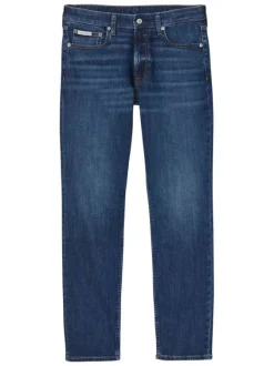 Jean en coton mélangé indigo uni avec une coupe slim à zip et bouton