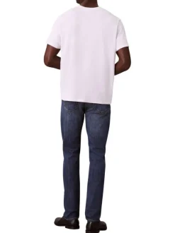 Jean en coton mélangé indigo uni avec une coupe slim à zip et bouton