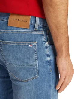 Jean en coton mélangé indigo uni à coupe slim avec poches et fermeture zippée