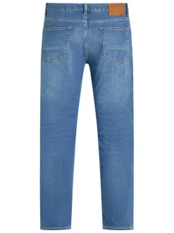 Jean en coton mélangé indigo uni à coupe slim avec poches et fermeture zippée