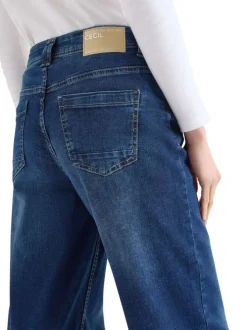Jean en coton mélangé indigo uni pourvu d'une coupe droite et d'une taille haute
