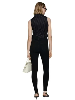 Jean en coton noir uni taille haute à coupe skinny avec rivets cuivrés