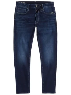 Jean en coton nuit avec une coupe slim et des passants pour ceinture