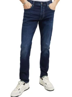 Jean en coton nuit avec une coupe slim et des passants pour ceinture