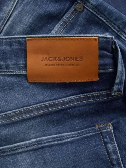 Jean Glenn bleu uni avec une coupe slim et des passants pour la ceinture