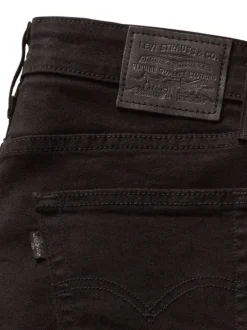 Jean 721 High Rise Skinny en coton mélangé noir uni avec une coupe skinny