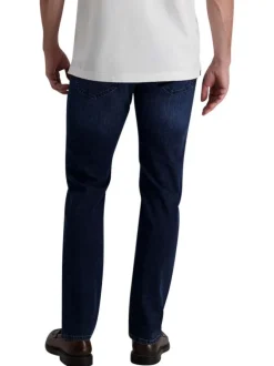 Jean indigo avec une coupe ajustée et une fermeture zippée avec un bouton