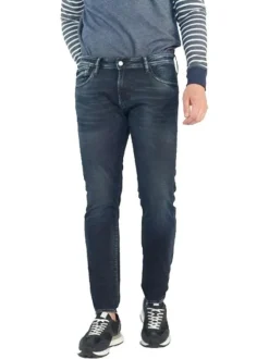 Jean 700/11 Jogg en coton indigo uni avec une coupe slim et des poches plaquées à l'arrière