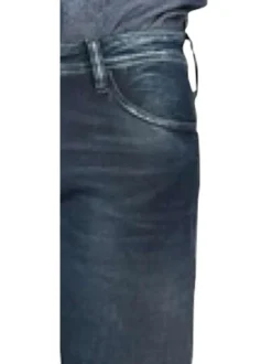 Jean 700/11 Jogg en coton indigo uni avec une coupe slim et des poches plaquées à l'arrière