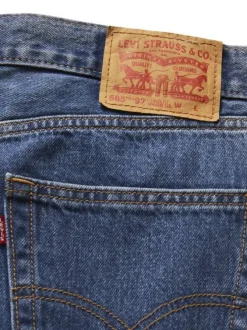 Jean 565 Loose Straight en coton bleu jean uni avec patch de la marque
