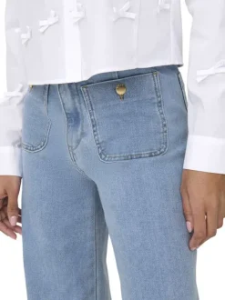 Jean Madeline en coton mélangé bleu uni avec une coupe flare