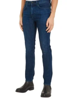 Jean nuit délavé avec une coupe slim à fermeture zippée boutonnée