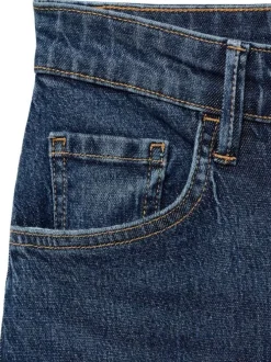 Jean 5 poches en coton indigo légèrement délavé avec une coupe bootcut
