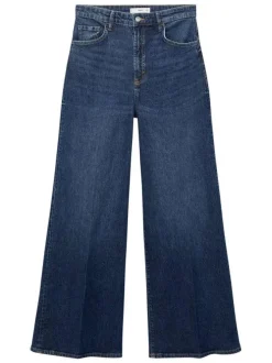 Jean 5 poches en coton indigo légèrement délavé avec une coupe bootcut