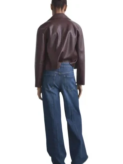 Jean 5 poches en coton indigo légèrement délavé avec une coupe bootcut