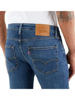 Jean 5 poches 512 Slim Taper en coton bleu uni à coupe slim à taille intermédiaire