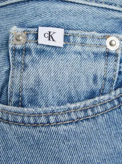 Jean Slim Straight en coton bleu uni délavé au niveau des genoux