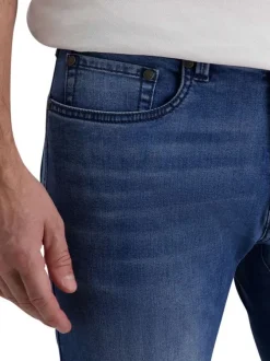 Jean stone avec une coupe ajustée et une fermeture zippée avec un bouton