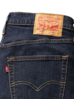 Jean 512® Taper indigo à coupe slim avec un patch de la marque