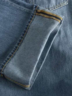 Jean Tokyo en coton bleu légèrement délavé à coupe bootcut et ourlets