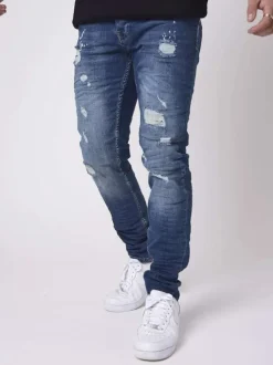 Jean troué en coton indigo uni avec une coupe skinny