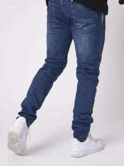 Jean troué en coton indigo uni avec une coupe skinny