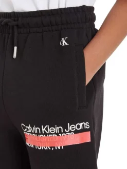 Jogging en coton noir uni avec nom de la marque inscrit sur la jambe gauche