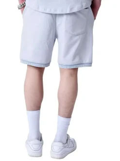 Jogging ciel uni avec le nom de la marque brodé et une coupe droite