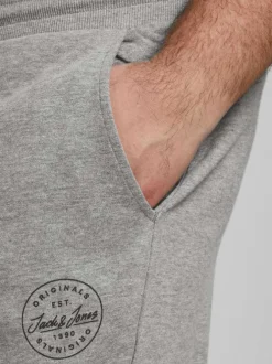 Jogging gris en coton uni avec une coupe droite et nom de la marque sur la cuisse gauche