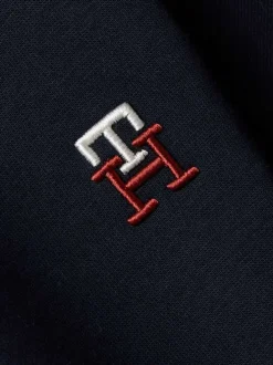 Jogging marine uni avec une coupe slim et un lien de serrage à la taille