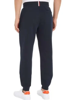 Jogging marine uni avec une coupe slim et un lien de serrage à la taille