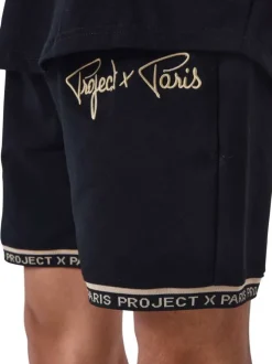 Jogging noir uni avec nom de la marque brodé et une coupe droite