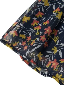 Jupe courte marine fleurie avec une coupe courte et liserés lurex