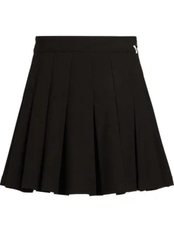 Jupe courte tennis noire unie plissée à coupe évasée fermée par un zip