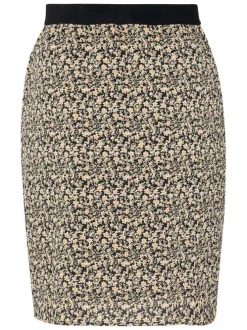 Jupe courte beige liberty avec une coupe droite et une taille noire élastiquée