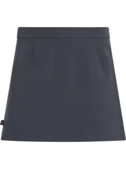 Jupe courte bleue ardoise unie avec une coupe trapèze et un revers