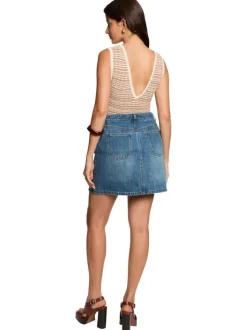Jupe courte en coton stone denim unie pourvue d'une coupe trapèze