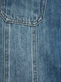 Jupe courte en coton stone denim unie pourvue d'une coupe trapèze