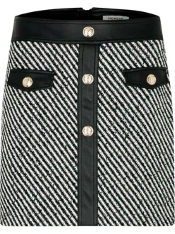 Jupe courte noire et blanche rayée en tissu tweed ornée de boutons
