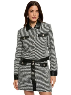Jupe courte noire et blanche rayée en tissu tweed ornée de boutons