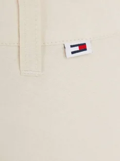 Jupe en coton mélangé beige unie avec une coupe courte et 4 passants